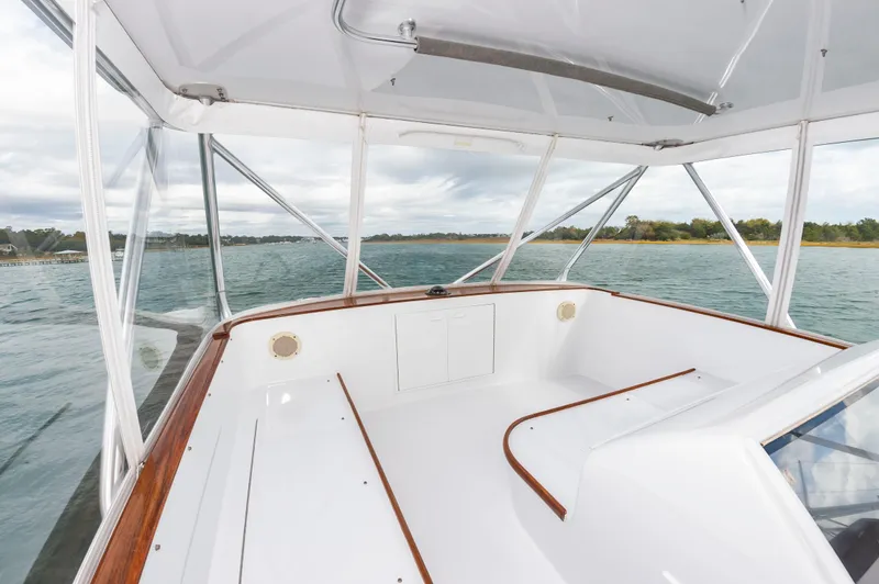 Safari Yacht Photos Pics 1997 Garlington 61 boat interior with clear windows, wooden trim, and scenic water view.