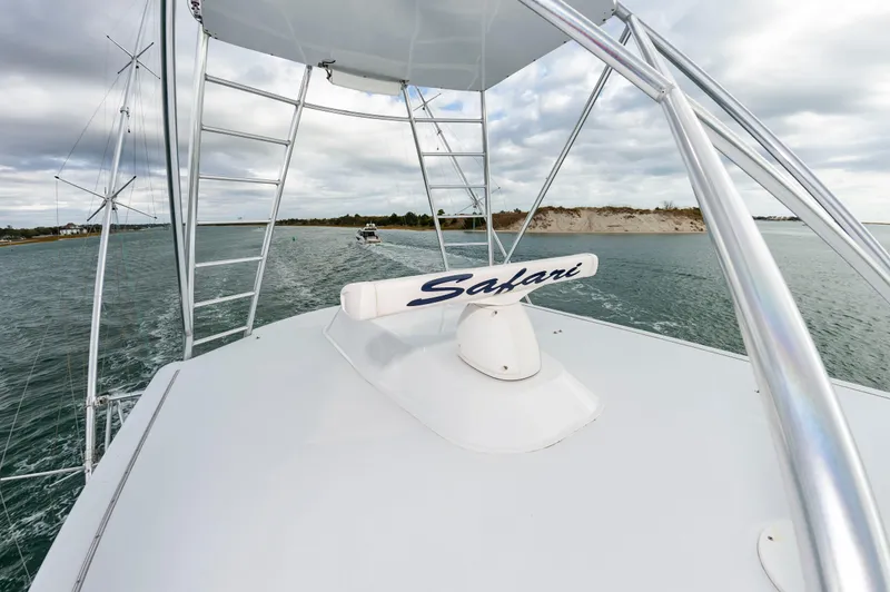 Safari Yacht Photos Pics 1997 Garlington 61 yacht "Safari" navigating coastal waters under cloudy skies.