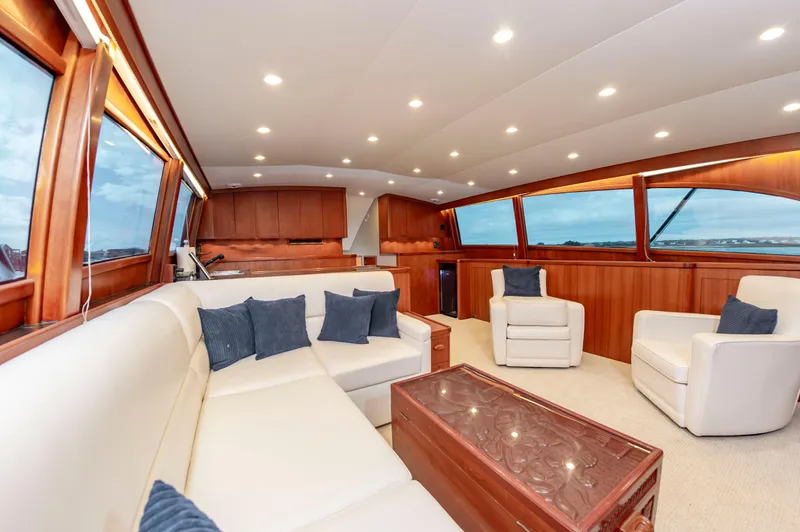 Safari Yacht Photos Pics Luxurious interior of a 1997 Garlington 61 yacht with elegant seating and wood finishes.