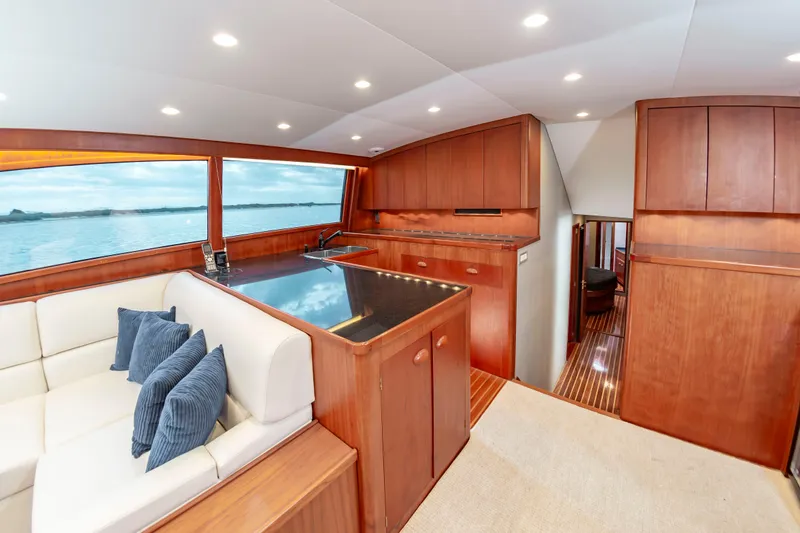 Safari Yacht Photos Pics Luxurious 1997 Garlington 61 yacht interior with elegant wood finishes and comfortable seating.