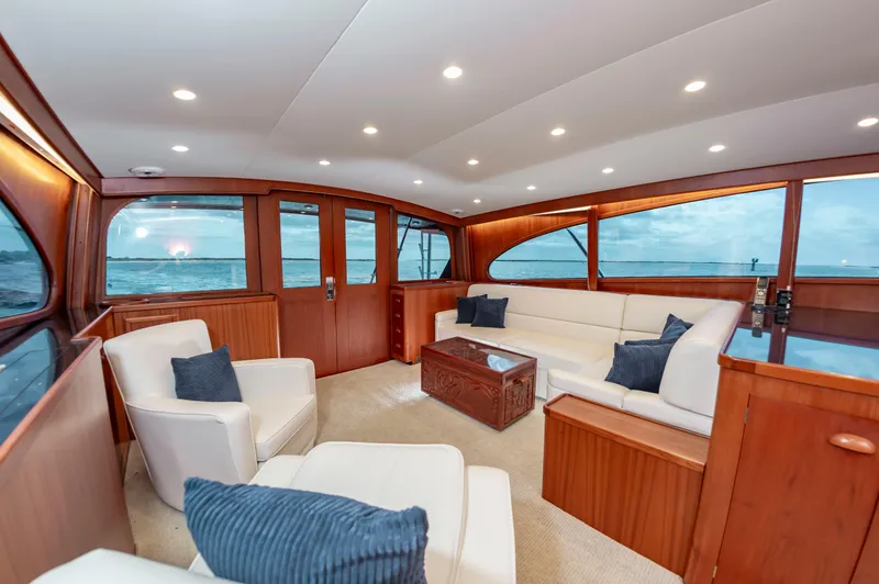 Safari Yacht Photos Pics Luxurious interior of a 1997 Garlington 61 yacht with elegant seating and ocean view.
