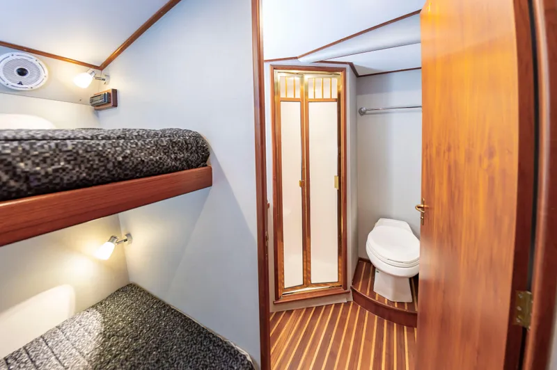 Safari Yacht Photos Pics Interior of 1997 Garlington 61 yacht with bunk beds and bathroom.
