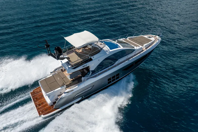  Yacht Photos Pics 2021 Azimut S6 Sportfly yacht cruising on open water, showcasing luxury design and speed.