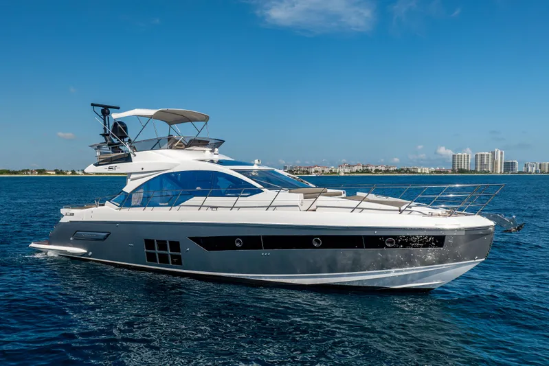  Yacht Photos Pics 2021 Azimut S6 Sportfly yacht cruising on open water under clear blue sky.