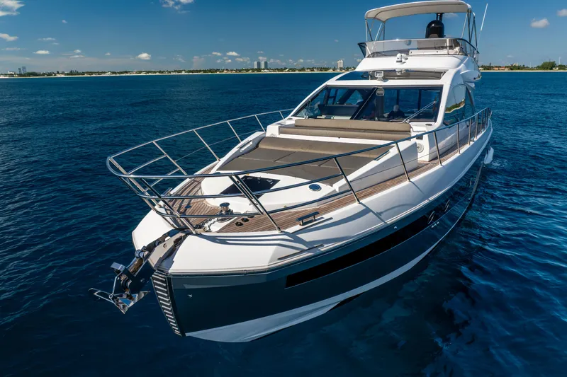  Yacht Photos Pics 2021 Azimut S6 Sportfly yacht cruising on open water under clear skies.