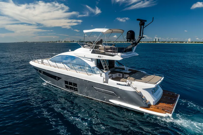  Yacht Photos Pics 2021 Azimut S6 Sportfly yacht cruising on open blue waters under a clear sky.