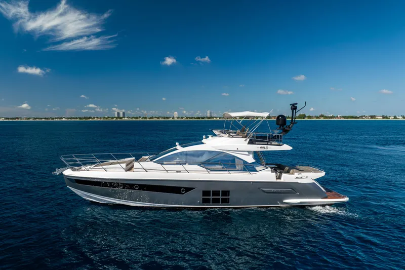  Yacht Photos Pics 2021 Azimut S6 Sportfly yacht cruising on open blue sea under clear sky.