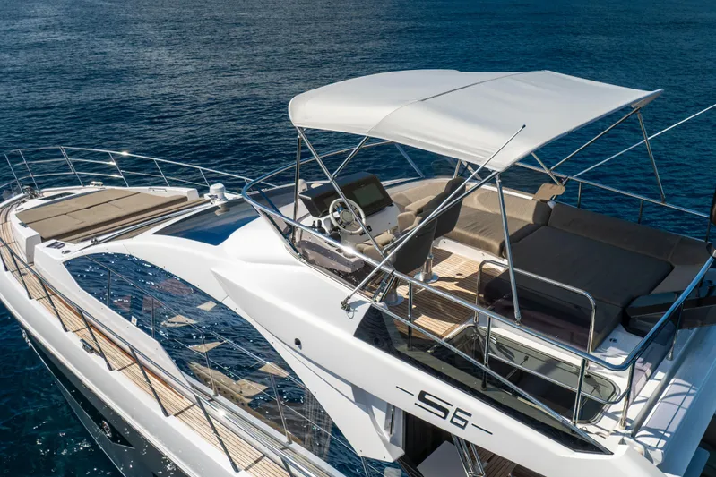  Yacht Photos Pics 2021 Azimut S6 Sportfly yacht with sleek design and spacious deck on open water.