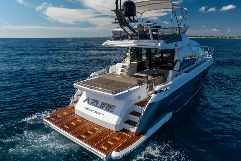  Yacht Photos Pics 2021 Azimut S6 Sportfly yacht cruising on open sea, featuring luxurious deck and seating.