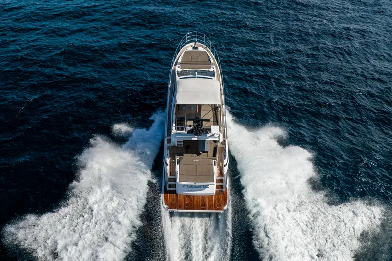  Yacht Photos Pics Azimut S6 Sportfly 2021 yacht cruising on open sea, aerial rear view.