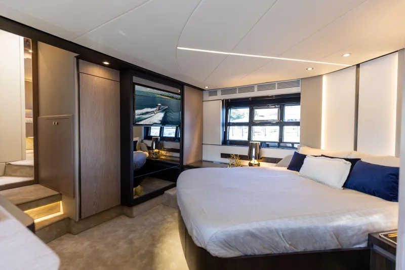 Yacht Photos Pics Luxurious bedroom interior of 2021 Azimut S6 Sportfly yacht with modern design and large windows.
