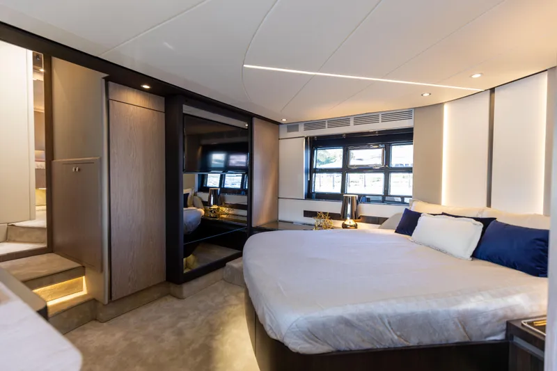  Yacht Photos Pics Luxurious bedroom interior of 2021 Azimut S6 Sportfly yacht with modern design and ambient lighting.