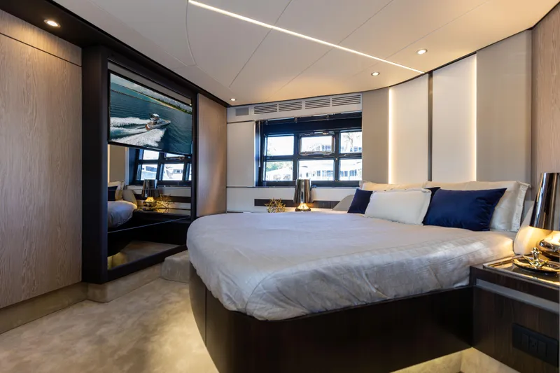  Yacht Photos Pics Luxurious bedroom interior of 2021 Azimut S6 Sportfly yacht with modern design and large windows.