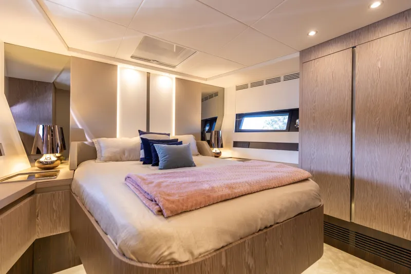  Yacht Photos Pics Luxurious bedroom interior of 2021 Azimut S6 Sportfly yacht with modern design and ambient lighting.