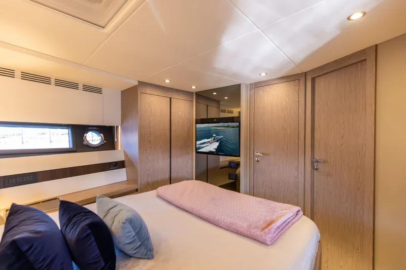  Yacht Photos Pics Luxurious bedroom interior of 2021 Azimut S6 Sportfly yacht with modern design and cozy ambiance.