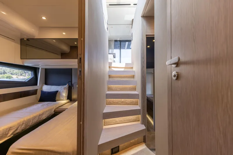  Yacht Photos Pics Luxurious interior of 2021 Azimut S6 Sportfly yacht with modern staircase and cozy cabin.