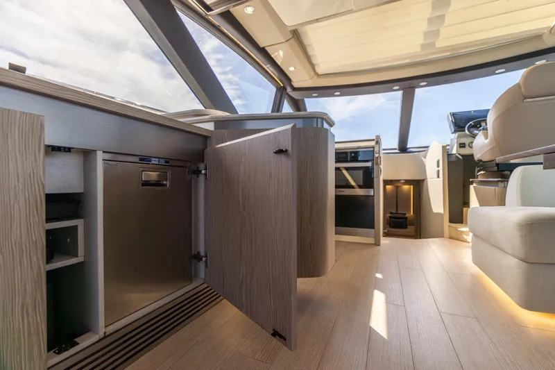  Yacht Photos Pics Luxurious interior of 2021 Azimut S6 Sportfly yacht with modern cabinetry and seating.