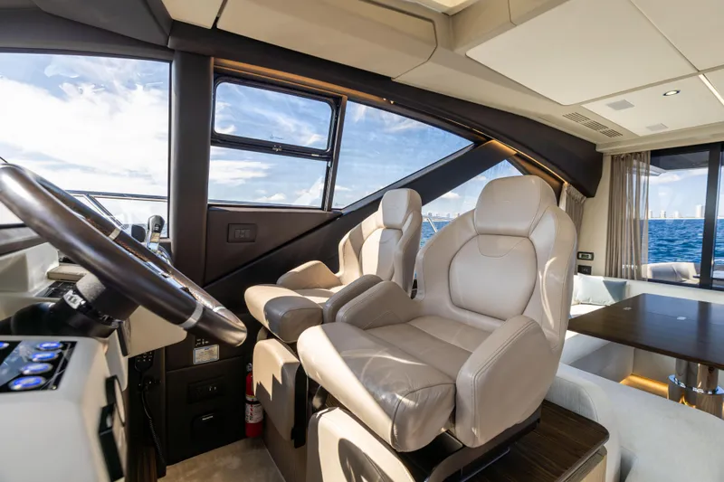  Yacht Photos Pics Luxurious interior of 2021 Azimut S6 Sportfly yacht with leather seating and ocean view.