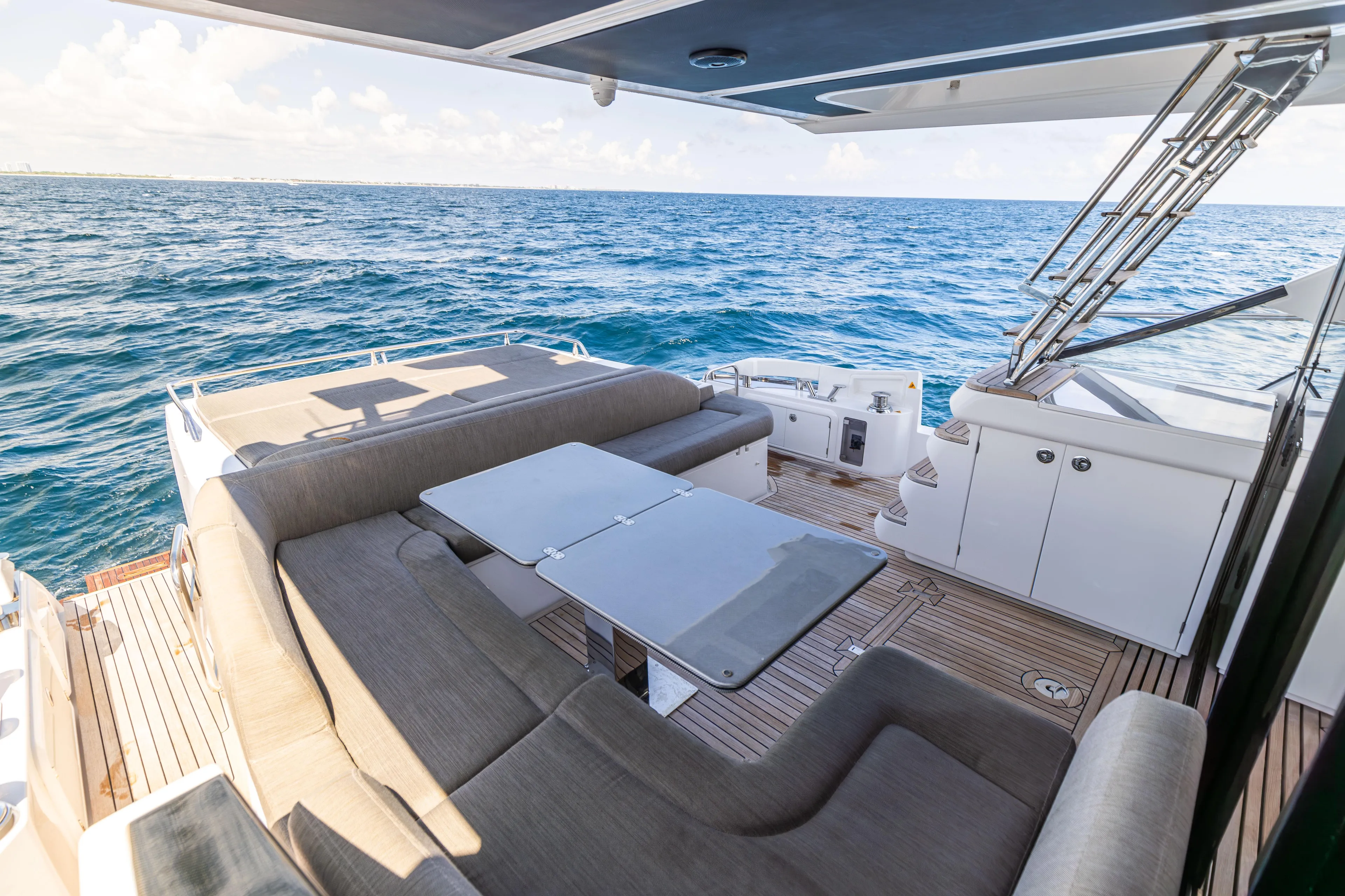  Yacht Photos Pics Luxurious 2021 Azimut S6 Sportfly yacht deck with ocean view and comfortable seating.
