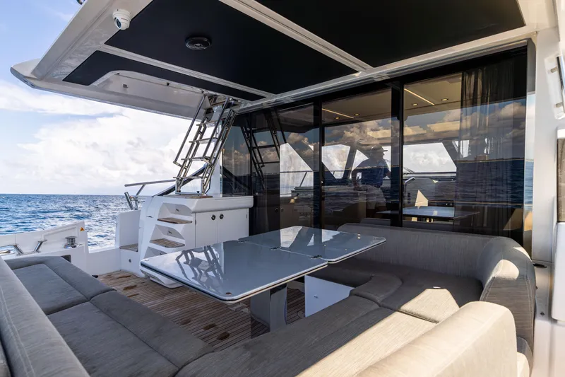  Yacht Photos Pics 2021 Azimut S6 Sportfly yacht with luxurious outdoor seating and ocean view.