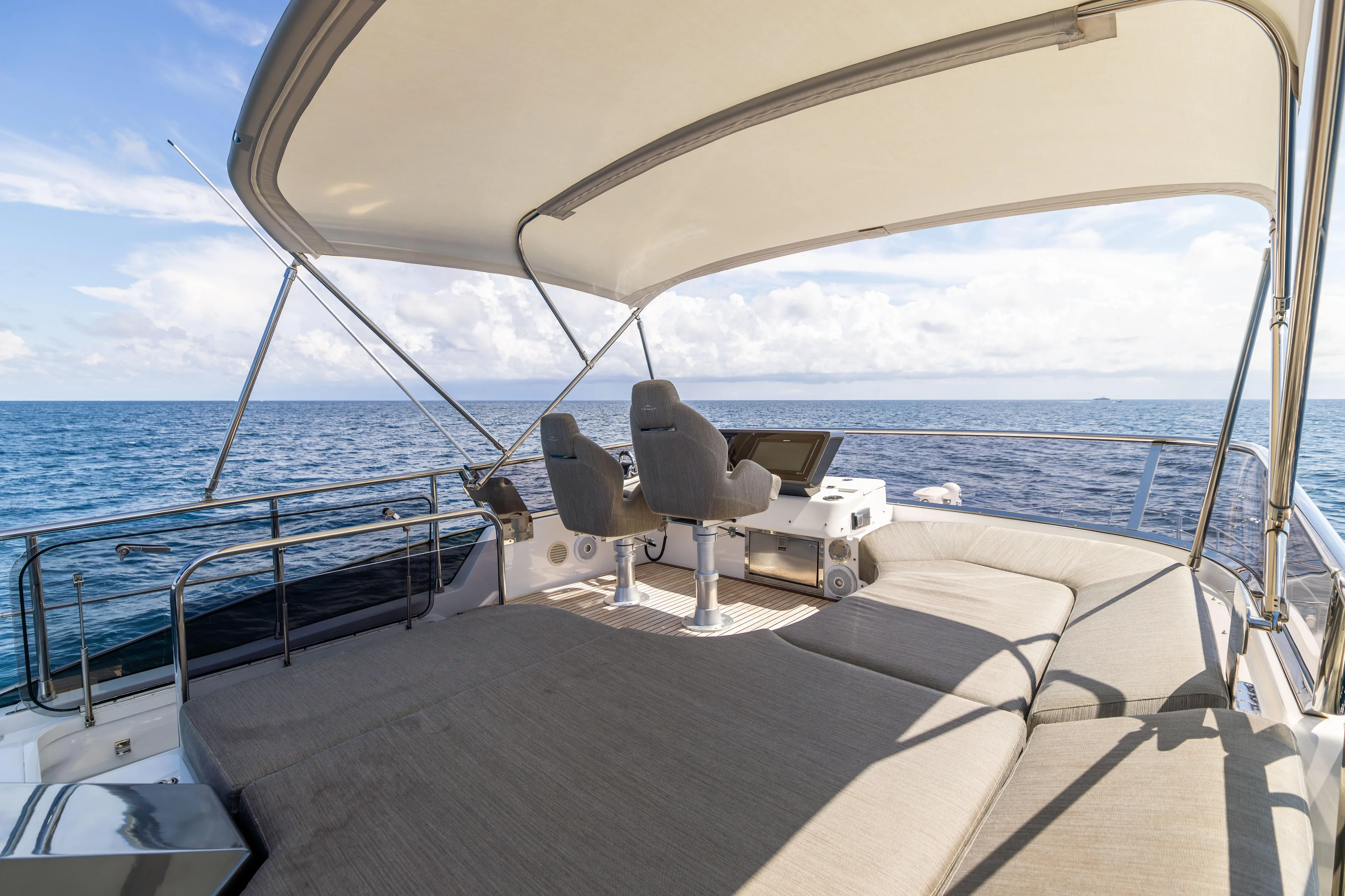  Yacht Photos Pics 2021 Azimut S6 Sportfly yacht deck with seating, ocean view, and canopy.