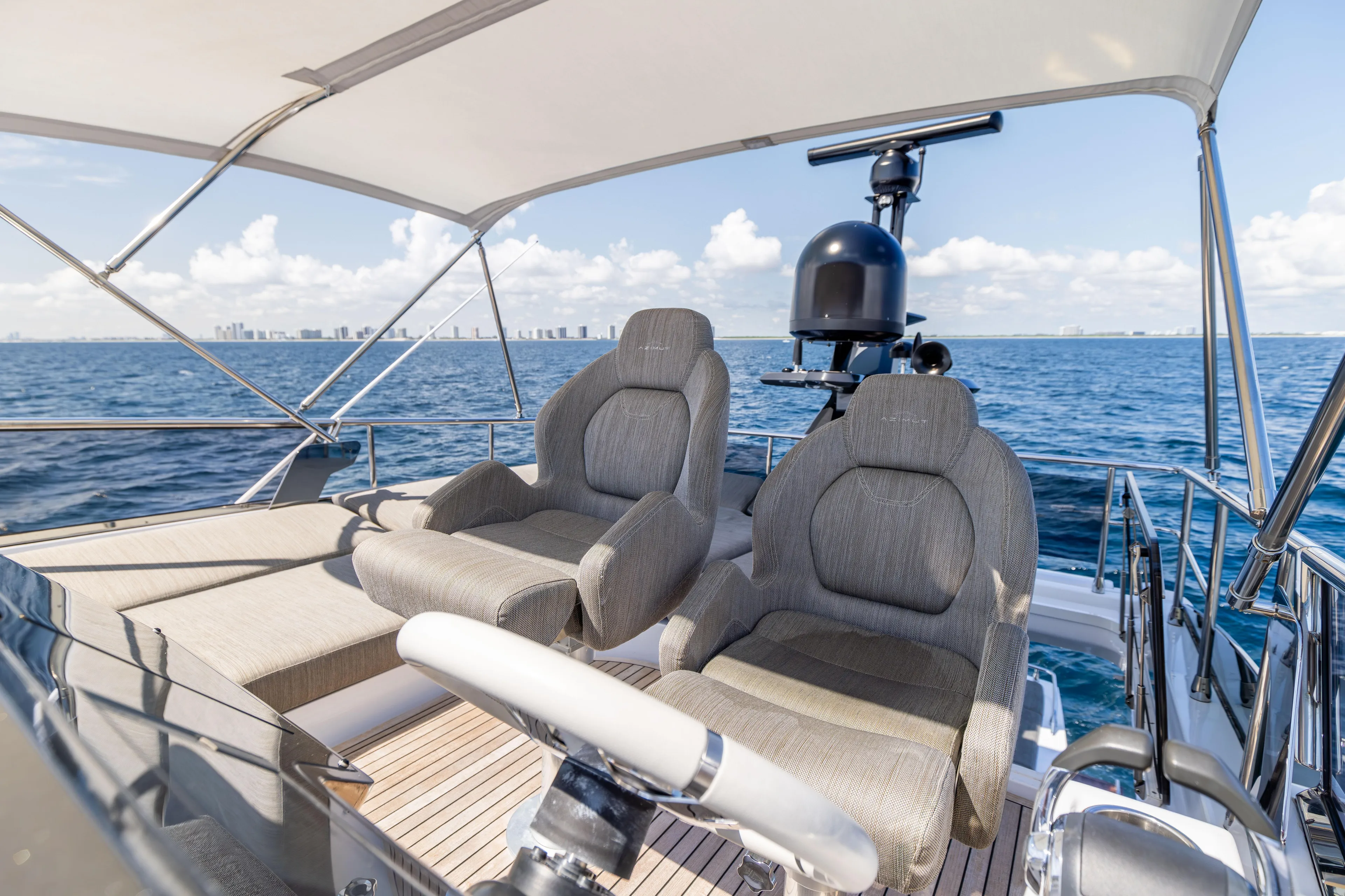  Yacht Photos Pics 2021 Azimut S6 Sportfly yacht helm with luxurious seating and ocean view.