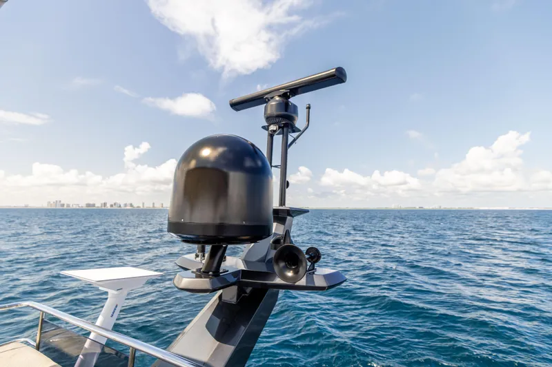  Yacht Photos Pics 2021 Azimut S6 Sportfly yacht radar system against ocean and skyline backdrop.