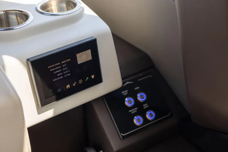  Yacht Photos Pics Control panel of 2021 Azimut S6 Sportfly yacht with digital display and cup holders.