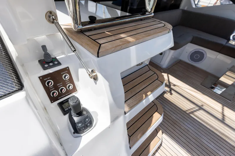  Yacht Photos Pics Interior of 2021 Azimut S6 Sportfly yacht with wooden steps and control panel.