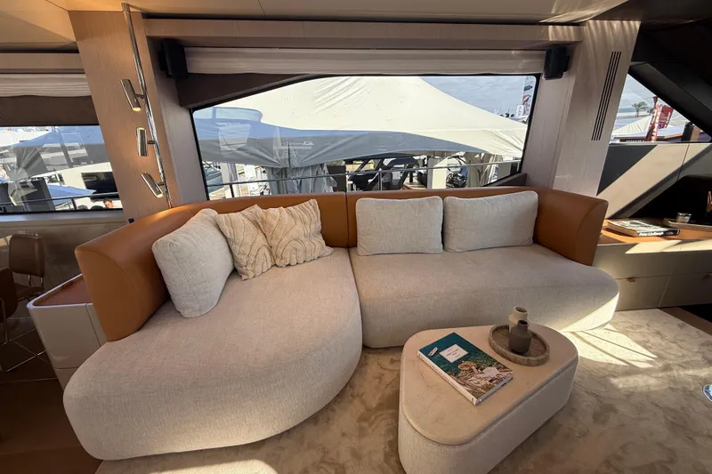  Yacht Photos Pics Luxurious interior of 2026 Cranchi 62 yacht with elegant beige and brown seating.