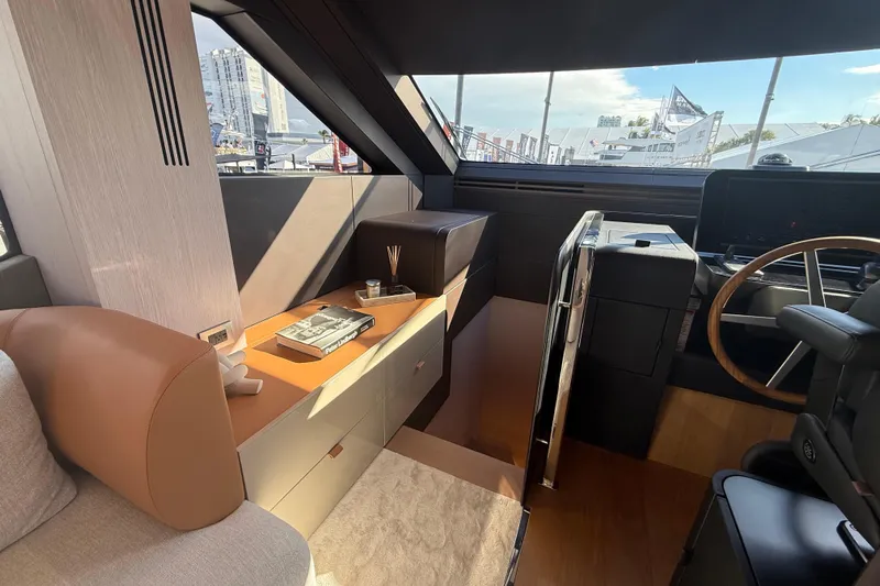  Yacht Photos Pics Luxurious interior of 2026 Cranchi 62 yacht with modern helm and elegant seating.