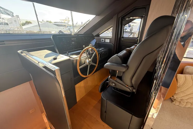  Yacht Photos Pics Luxurious helm station of 2026 Cranchi 62 yacht with modern controls and leather seating.