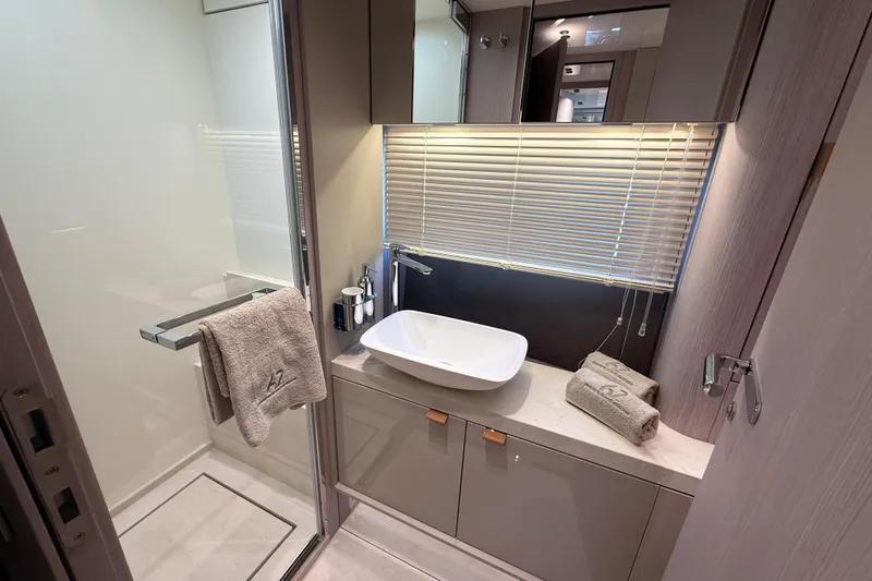  Yacht Photos Pics Modern bathroom interior on 2026 Cranchi 62 yacht, featuring sleek sink and elegant design.