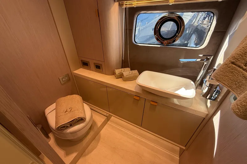  Yacht Photos Pics Luxurious bathroom in 2026 Cranchi 62 yacht with modern fixtures and elegant design.