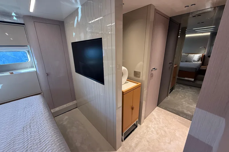  Yacht Photos Pics Luxurious interior of 2026 Cranchi 62 yacht featuring modern bedroom and sleek design elements.