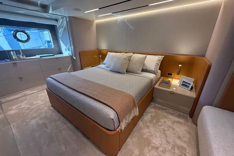  Yacht Photos Pics Luxurious bedroom interior of 2026 Cranchi 62 yacht with modern design and elegant furnishings.