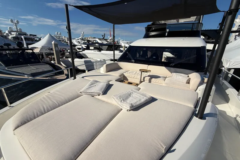  Yacht Photos Pics Luxurious 2026 Cranchi 62 yacht with spacious sunbathing deck and elegant seating area.