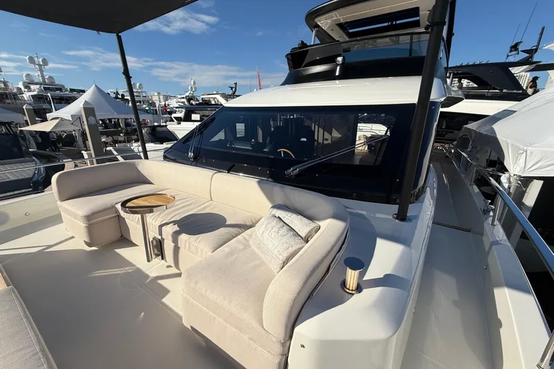  Yacht Photos Pics Luxurious 2026 Cranchi 62 yacht with elegant outdoor seating and modern design.