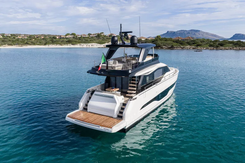  Yacht Photos Pics Luxury Cranchi 62 Sessantadue yacht, 2026 model, cruising in serene blue waters.