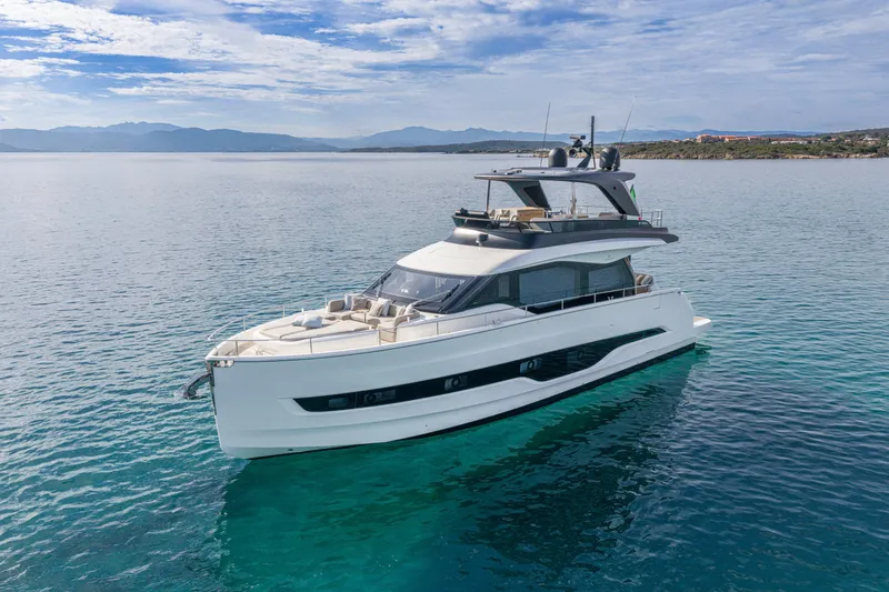  Yacht Photos Pics Luxury 2026 Cranchi 62 Sessantadue yacht on serene blue waters.