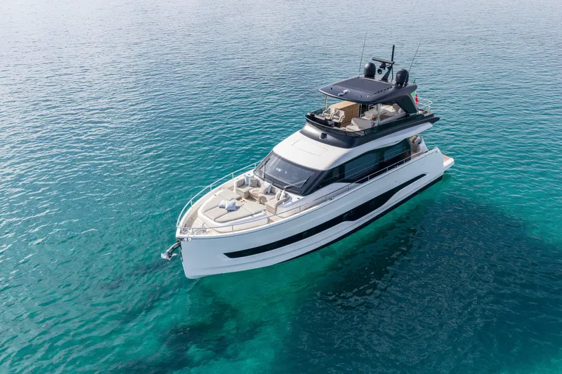  Yacht Photos Pics Luxury Cranchi 62 Sessantadue yacht, 2026 model, cruising on clear blue waters.