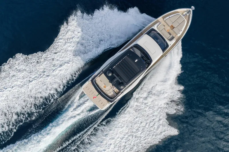  Yacht Photos Pics Aerial view of 2026 Cranchi 62 Sessantadue yacht cruising on open water.