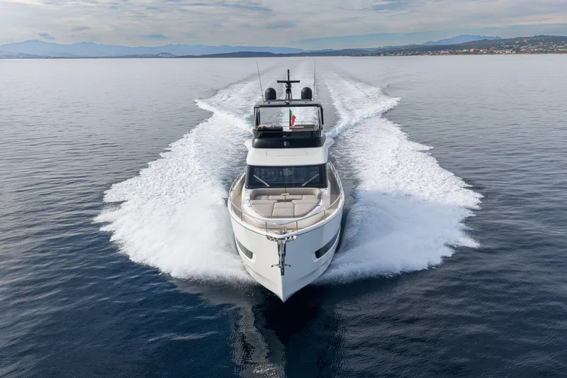  Yacht Photos Pics 2026 Cranchi 62 Sessantadue yacht cruising on open water, creating a dynamic wake.