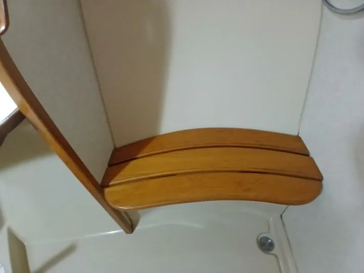 Wonderwind Yacht Photos Pics Wooden seat in the shower area of a 1999 Island Packet 45 yacht.