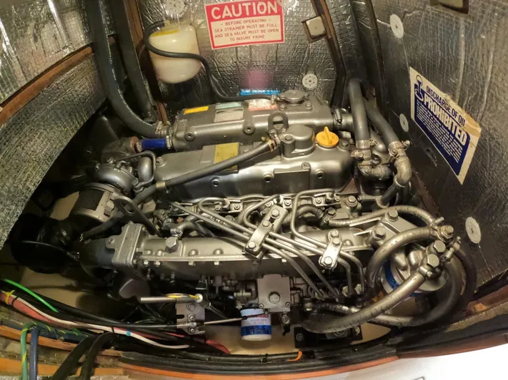 Wonderwind Yacht Photos Pics Engine compartment of a 1999 Island Packet 45 sailboat, showcasing detailed mechanical components.