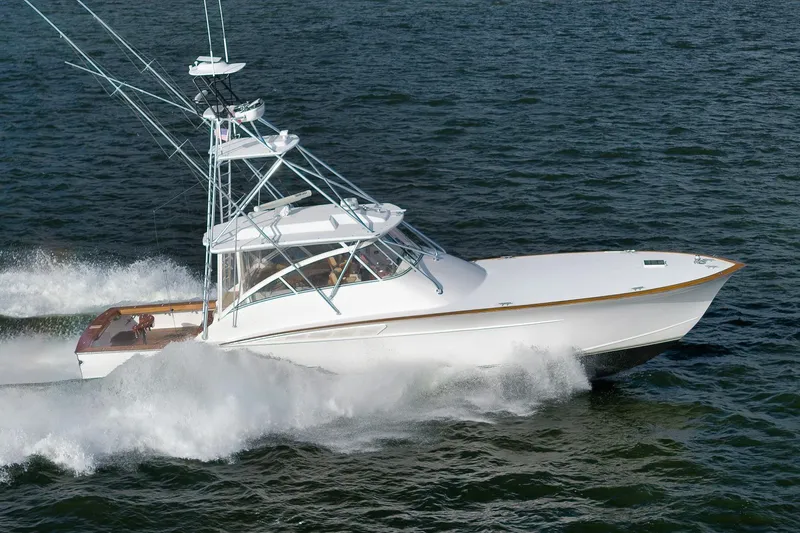 Magadi Yacht Photos Pics 2015 Ritchie Howell Express boat cruising on open water, showcasing sleek design and performance.