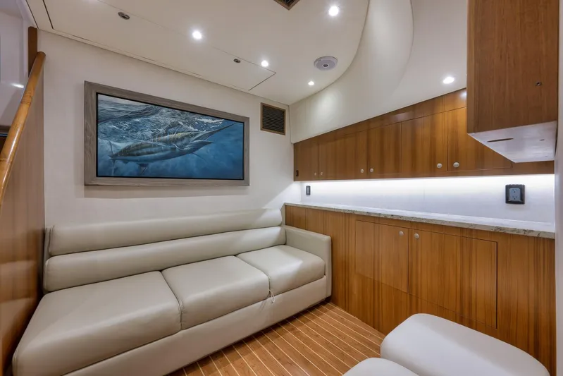 Magadi Yacht Photos Pics Luxurious 2015 Ritchie Howell Express yacht interior with leather seating and elegant wood cabinetry.