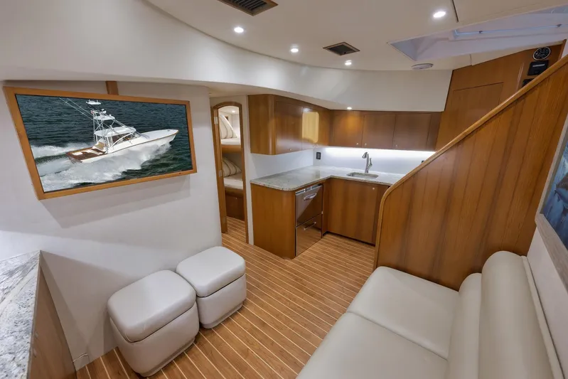Magadi Yacht Photos Pics Luxurious interior of 2015 Ritchie Howell Express yacht with modern kitchen and seating area.