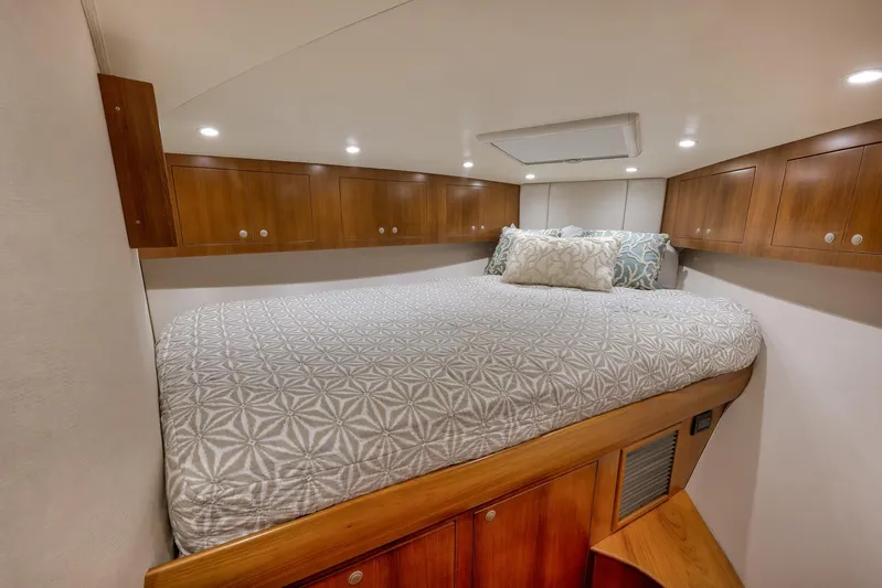 Magadi Yacht Photos Pics Luxurious cabin interior of 2015 Ritchie Howell Express yacht with cozy bedding.