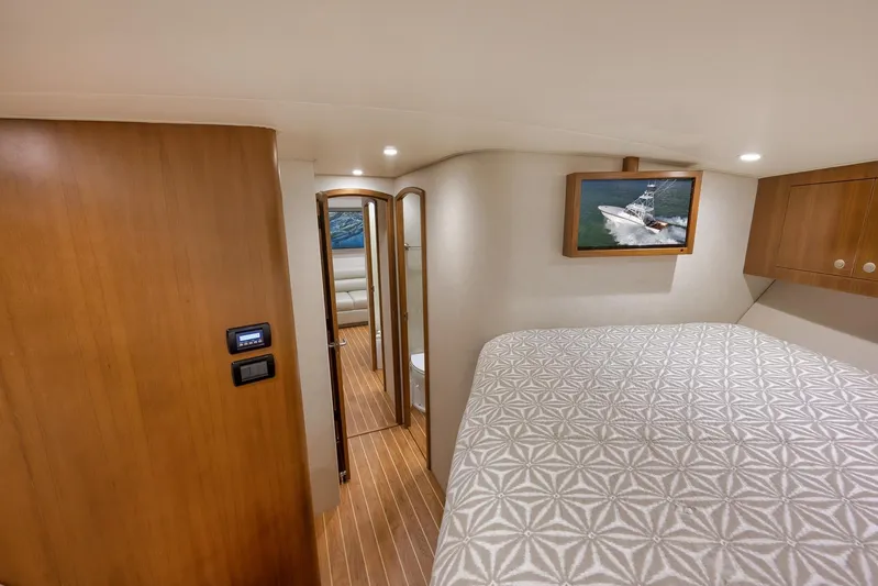 Magadi Yacht Photos Pics Luxurious 2015 Ritchie Howell Express yacht interior with elegant wood finishes and cozy bedroom.